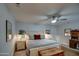 The bright bedroom features a ceiling fan, nightstands, and an inviting king size bed at 5674 N 12Th St, Phoenix, AZ 85014