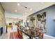 Elegant dining room with long table, chandelier lighting, and modern wall art at 5674 N 12Th St, Phoenix, AZ 85014