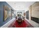 Dining room with modern chandelier, large windows, wood-look tile floors and fireplace at 5674 N 12Th St, Phoenix, AZ 85014