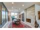 Charming dining room with a brick fireplace, decorative rug, and a bright window for natural light at 5674 N 12Th St, Phoenix, AZ 85014