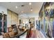 Elegant dining room featuring a fireplace, modern chandelier, and an open view to the gourmet kitchen at 5674 N 12Th St, Phoenix, AZ 85014