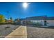 Charming single-story home with a blue-grey tile roof, landscaped yard, and inviting front entryway at 5674 N 12Th St, Phoenix, AZ 85014