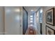 Hallway featuring modern doors, accent wall, and stylish rug leading to the home's entry at 5674 N 12Th St, Phoenix, AZ 85014