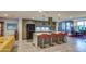Bright kitchen with stainless appliances, sleek countertops, and seating at island at 5674 N 12Th St, Phoenix, AZ 85014