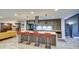 Spacious kitchen with modern appliances, island seating, and stylish pendant lighting at 5674 N 12Th St, Phoenix, AZ 85014