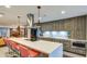 Modern kitchen with long island, stainless appliances, barstool seating and pendant lights at 5674 N 12Th St, Phoenix, AZ 85014