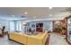Spacious living room with a brick fireplace, modern lighting, and access to the outdoors at 5674 N 12Th St, Phoenix, AZ 85014