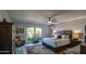 Serene main bedroom with a ceiling fan, a large window, and elegant furnishings at 5674 N 12Th St, Phoenix, AZ 85014