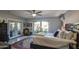 Cozy main bedroom with a ceiling fan, natural light, and access to an outdoor patio at 5674 N 12Th St, Phoenix, AZ 85014