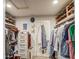 A walk-in closet with custom shelving and storage solutions to help organize your wardrobe at 5674 N 12Th St, Phoenix, AZ 85014