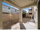 View of backyard with covered patio and block wall at 6455 W Orchid Ln, Glendale, AZ 85302