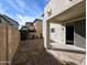 View of backyard with patio, rock landscaping, and privacy fence at 6455 W Orchid Ln, Glendale, AZ 85302