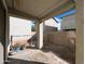 Cozy backyard featuring block fence and covered patio at 6455 W Orchid Ln, Glendale, AZ 85302