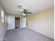 Bedroom boasts neutral carpet, a closet, and bright, natural light at 6455 W Orchid Ln, Glendale, AZ 85302