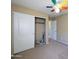 Bedroom with a large closet and neutral carpet at 6455 W Orchid Ln, Glendale, AZ 85302