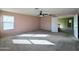 This bedroom features carpet, neutral paint, and doorway to the upstairs loft at 6455 W Orchid Ln, Glendale, AZ 85302