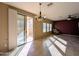 Open dining and living area with backyard access and lots of natural light at 6455 W Orchid Ln, Glendale, AZ 85302