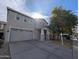 Exterior view of this two-story home featuring an attached two car garage and covered front porch at 6455 W Orchid Ln, Glendale, AZ 85302