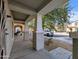 Covered front porch with stately columns offering a sheltered space with views of the quiet street at 6455 W Orchid Ln, Glendale, AZ 85302