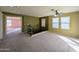 This spacious loft features neutral paint, carpet, and a ceiling fan at 6455 W Orchid Ln, Glendale, AZ 85302