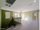 This spacious loft features carpet, neutral paint, two large windows, and a ceiling fan at 6455 W Orchid Ln, Glendale, AZ 85302