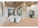 Elegant dining room with a wine storage feature and modern light fixture at 6516 E Meadowlark Ln, Paradise Valley, AZ 85253