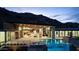 Luxury home with a stunning pool and mountain views at night at 6516 E Meadowlark Ln, Paradise Valley, AZ 85253