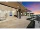 Outdoor living space with fireplace, infinity pool and city views at 6516 E Meadowlark Ln, Paradise Valley, AZ 85253