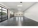 Spacious garage with glass roll-up door and polished concrete floor at 6516 E Meadowlark Ln, Paradise Valley, AZ 85253