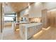 Gourmet kitchen with marble island, high-end appliances, and wood flooring at 6516 E Meadowlark Ln, Paradise Valley, AZ 85253
