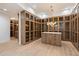 Spacious walk-in closet with ample shelving and custom cabinetry at 6516 E Meadowlark Ln, Paradise Valley, AZ 85253