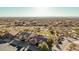 An aerial view of a desert community with a well manicured lawn with natural desert landscaping at 7735 E Russell Cir, Mesa, AZ 85207