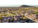 An aerial view of a desert home with a well manicured lawn with natural desert landscaping at 7735 E Russell Cir, Mesa, AZ 85207