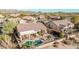 This backyard features a private pool, covered patio, and lush desert landscaping, perfect for relaxing and entertaining at 7735 E Russell Cir, Mesa, AZ 85207