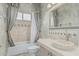 Elegant bathroom featuring a mosaic sink, custom tile, and decorative drapes for a luxurious feel at 7735 E Russell Cir, Mesa, AZ 85207