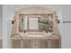 Stylish bathroom featuring dual sinks, decorative mirrors, and custom vanities at 7735 E Russell Cir, Mesa, AZ 85207