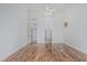 Spacious bedroom with hardwood flooring, white walls and ceiling fan at 7735 E Russell Cir, Mesa, AZ 85207