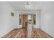 Inviting bedroom showcasing wood floors and large windows that let in plenty of natural light at 7735 E Russell Cir, Mesa, AZ 85207