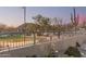 Picturesque view of a community park with walking paths, gazebos, desert landscaping, and mountain views at 7735 E Russell Cir, Mesa, AZ 85207