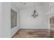 Elegant dining room with hardwood floors and a decorative chandelier at 7735 E Russell Cir, Mesa, AZ 85207