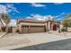 Charming home exterior with a three-car garage, desert landscaping, and inviting curb appeal at 7735 E Russell Cir, Mesa, AZ 85207