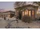 Charming home featuring desert landscaping, an arched entryway, and a tile roof at 7735 E Russell Cir, Mesa, AZ 85207
