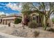 Charming home featuring a desert-landscaped front yard and lush bougainvillea at 7735 E Russell Cir, Mesa, AZ 85207