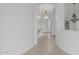 Bright hallway with arched entry and decorative console table at 7735 E Russell Cir, Mesa, AZ 85207