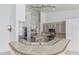 Bright kitchen featuring decorative breakfast bar, light cabinetry, and modern appliances at 7735 E Russell Cir, Mesa, AZ 85207
