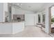 Well-lit kitchen and breakfast nook featuring ceramic tile, breakfast bar, and outdoor views at 7735 E Russell Cir, Mesa, AZ 85207