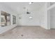 Bright living area featuring tile floors, a ceiling fan, and natural lighting at 7735 E Russell Cir, Mesa, AZ 85207