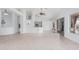 Spacious living area with ceramic tile, breakfast bar, and seamless access to outdoors at 7735 E Russell Cir, Mesa, AZ 85207