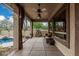 Covered patio featuring comfortable seating, elegant decor, and a ceiling fan for relaxed outdoor living at 7735 E Russell Cir, Mesa, AZ 85207