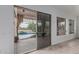 Living area with sliding glass doors offering a view of the pool and patio at 7735 E Russell Cir, Mesa, AZ 85207